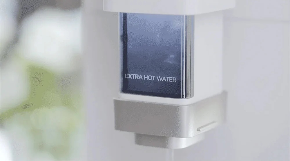 See-through dispenser showing 100 degree hot watter